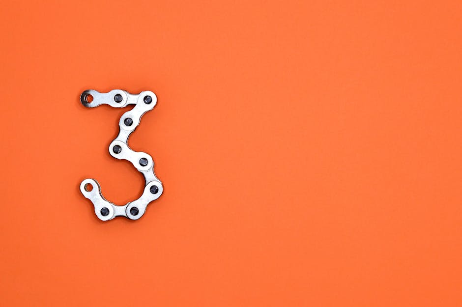 Metal bicycle chain links shaped into the number 3